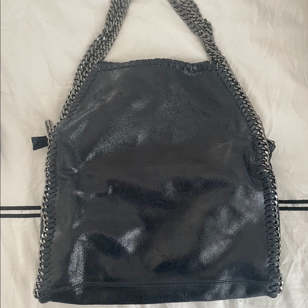 Navy blue shoulder bag with silver hardware.